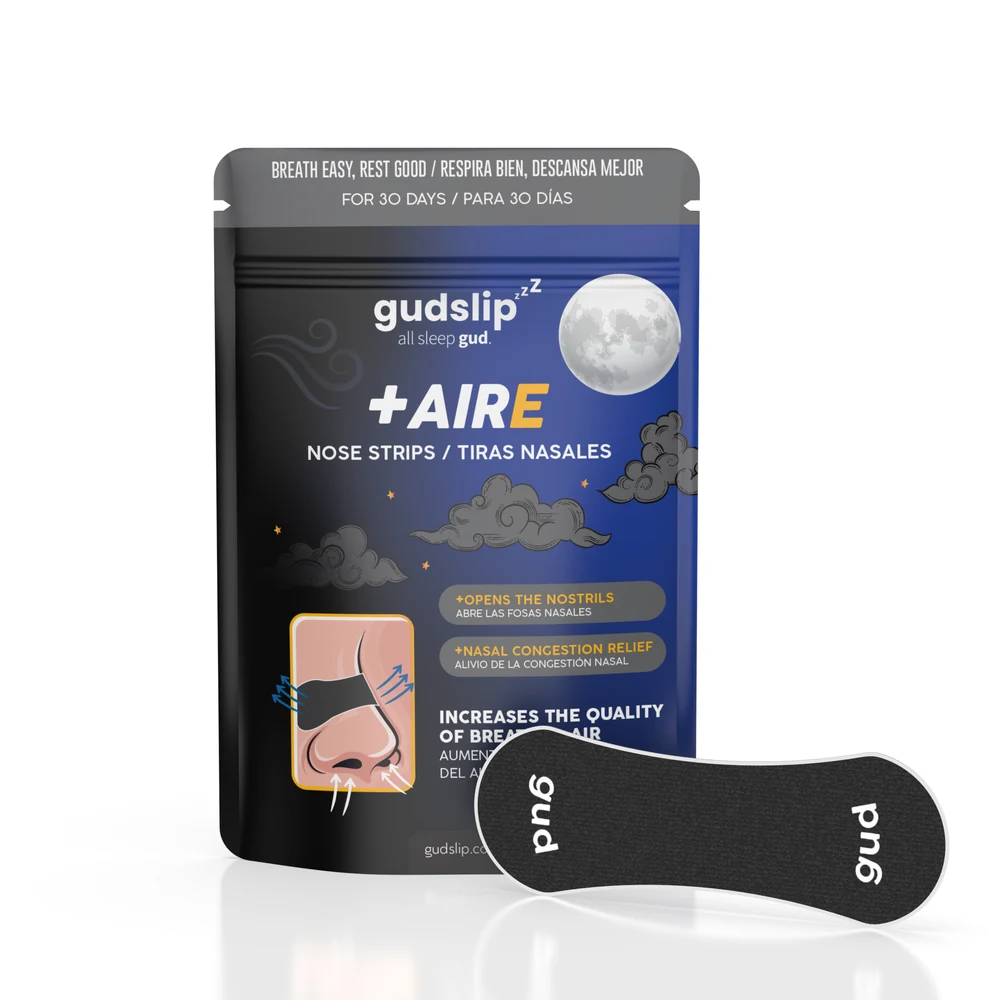 Envase original de tiras nasales Gudslip +AIRE y una tira negra.